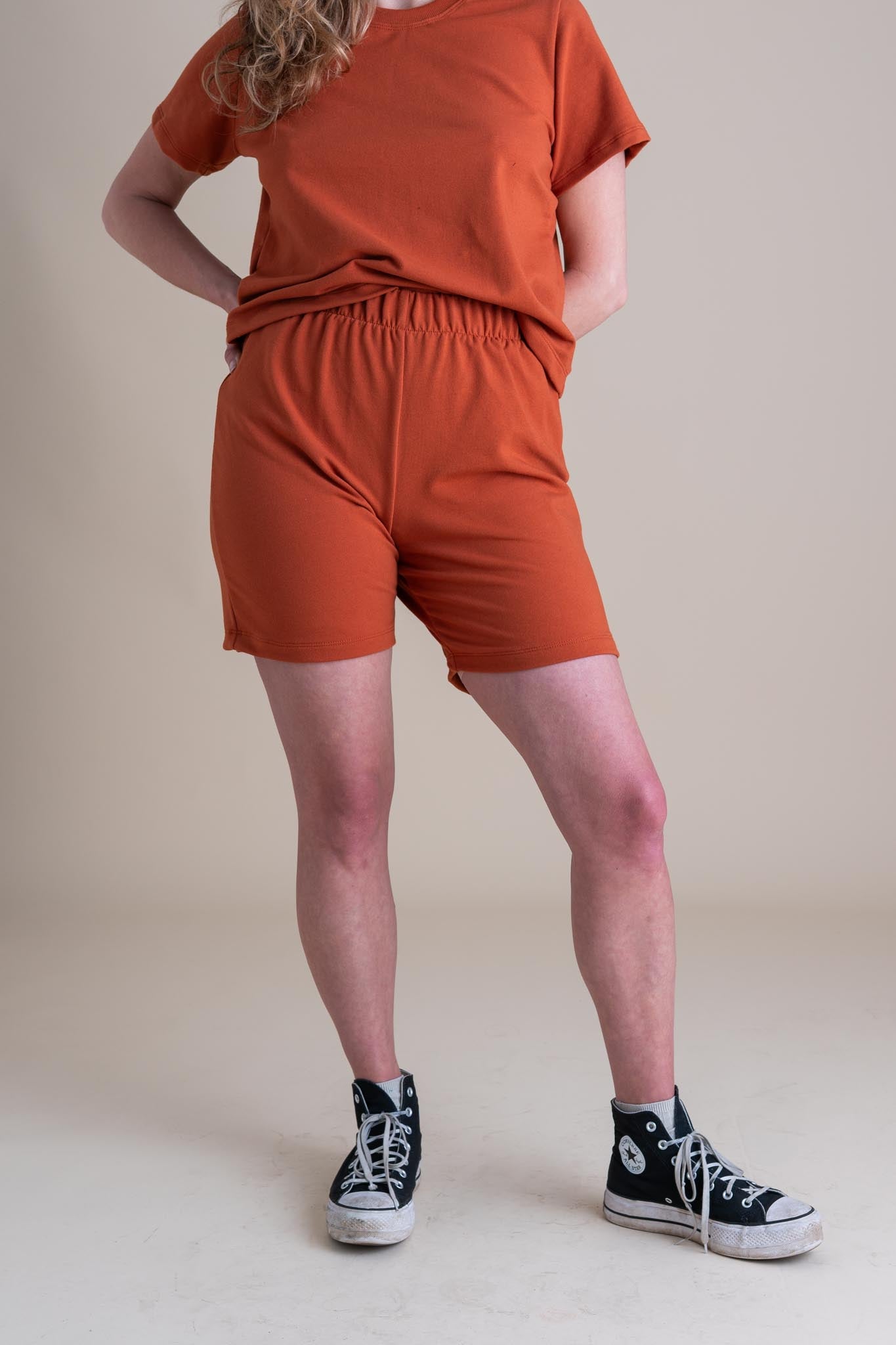 Audra is wearing a size M 7".
